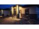 Charming home exterior featuring stone accents, sconce lighting, and large windows at 13074 Sw 104Th Ln, Dunnellon, FL 34432