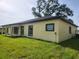 Lovely house with the black roof and yellow siding with the trees at 13074 Sw 104Th Ln, Dunnellon, FL 34432