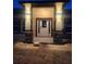 Inviting front entrance with decorative stone pillars and sconce lighting at 13074 Sw 104Th Ln, Dunnellon, FL 34432
