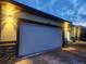 The exterior displays a two-car garage and stone accents, enhancing the property's appeal at 13074 Sw 104Th Ln, Dunnellon, FL 34432
