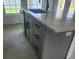 Kitchen island with a marble countertop and a stainless sink at 13074 Sw 104Th Ln, Dunnellon, FL 34432