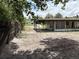 A large backyard includes a covered patio perfect for outdoor relaxation and gatherings at 2448 Austin Ave, Deltona, FL 32738