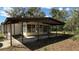 Covered patio for outdoor relaxation and dining at 2448 Austin Ave, Deltona, FL 32738