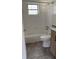 Full bathroom with tiled walls and floors, shower and tub combo, and vanity at 2448 Austin Ave, Deltona, FL 32738