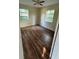 Cozy bedroom featuring laminate floors, neutral paint, and natural light at 2448 Austin Ave, Deltona, FL 32738