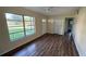 Bright living room featuring laminate floors, large window for natural light, and neutral colors at 2448 Austin Ave, Deltona, FL 32738