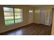 Inviting living room with laminate floors and natural light, freshly painted in neutral colors at 2448 Austin Ave, Deltona, FL 32738