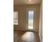 Entryway featuring a frosted-glass door with a sidelight and light wood-look floors at 1710 Summer Rose Dr, Mount Dora, FL 32757