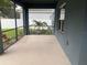 Enclosed lanai offering a relaxing view of the beautifully landscaped backyard at 1710 Summer Rose Dr, Mount Dora, FL 32757