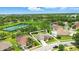 An aerial view of a well-maintained property and community featuring lush landscaping and nearby community features at 3909 Corveta Ct, Orlando, FL 32837