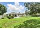 Lovely backyard with a refreshing pool, manicured lawn, and a charming fence line at 3909 Corveta Ct, Orlando, FL 32837