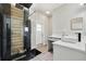Modern bathroom boasts a wood look tiled walk-in shower, and vanity with vessel sink at 3909 Corveta Ct, Orlando, FL 32837