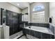 Stylish bathroom features soaking tub, glass shower, and modern finishes at 3909 Corveta Ct, Orlando, FL 32837