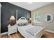 Cozy bedroom with a bed, wood floors, and a mirror at 3909 Corveta Ct, Orlando, FL 32837