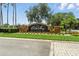 Orista Bay community entrance sign with manicured landscaping and sunny skies at 3909 Corveta Ct, Orlando, FL 32837