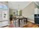 Inviting dining room with natural light, stylish chandelier, and easy access to the entryway and kitchen at 3909 Corveta Ct, Orlando, FL 32837