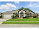 Charming single-story home with a well-manicured lawn and a two-car garage at 3909 Corveta Ct, Orlando, FL 32837