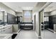 Spacious main bathroom features soaking tub, glass shower, and double vanity at 3909 Corveta Ct, Orlando, FL 32837