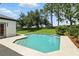 Inviting backyard pool featuring a clean patio, lush landscaping, and a sunny atmosphere at 3909 Corveta Ct, Orlando, FL 32837
