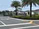 Gated community entrance with lush landscaping and prominent signage at 742 Copper Creek Dr, New Smyrna Beach, FL 32168