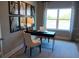 Bright home office featuring a black desk, comfortable chairs, and attractive decor at 742 Copper Creek Dr, New Smyrna Beach, FL 32168