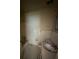 Functional bathroom with shower and toilet, ideal for complete renovation at 1516 Avenue D Ne, Winter Haven, FL 33881