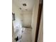 Bathroom featuring tile flooring with a shower and toilet. Ready for renovation at 1516 Avenue D Ne, Winter Haven, FL 33881