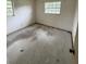 A secondary bedroom with window offering natural light, awaiting personalized updates at 1516 Avenue D Ne, Winter Haven, FL 33881