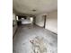 Spacious living room featuring an open layout with ample natural light, needs renovation to maximize potential at 1516 Avenue D Ne, Winter Haven, FL 33881