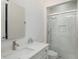 Modern bathroom featuring a glass-enclosed shower with marble tile and contemporary fixtures at 1841 Moorings Ct, Clermont, FL 34711