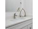 Close-up of a sleek bathroom sink featuring modern fixtures, a marble countertop, and elegant decor at 1841 Moorings Ct, Clermont, FL 34711
