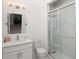 Bathroom with large vanity and sleek glass enclosed shower with modern fixtures at 1841 Moorings Ct, Clermont, FL 34711
