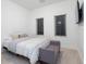 Comfortable bedroom with neutral decor, cozy carpet, and a stylish grey bench at 1841 Moorings Ct, Clermont, FL 34711