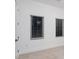 Bedroom featuring two windows with blinds at 1841 Moorings Ct, Clermont, FL 34711