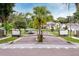 Gated entrance to a private community with well-manicured landscaping and secure access at 1841 Moorings Ct, Clermont, FL 34711