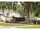 Welcoming entrance to 'The Moorings of Clermont' community with lush landscaping and signage at 1841 Moorings Ct, Clermont, FL 34711