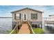 Charming waterfront home with a private dock, providing direct access to the lake at 1841 Moorings Ct, Clermont, FL 34711