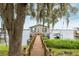 Waterfront home featuring a private dock, with access to boat slip on a serene lake at 1841 Moorings Ct, Clermont, FL 34711