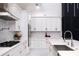 Modern kitchen featuring sleek countertops, stainless steel appliances, and marble backsplash at 1841 Moorings Ct, Clermont, FL 34711
