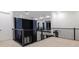 Loft space featuring contemporary railing and accent wall with modern lighting at 1841 Moorings Ct, Clermont, FL 34711