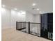 Loft space featuring contemporary railing and accent wall with modern lighting at 1841 Moorings Ct, Clermont, FL 34711