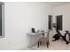 Home office featuring a desk, chair, stationary bicycle, and bright light at 1841 Moorings Ct, Clermont, FL 34711