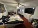 A bedroom with a large bed and a TV on the wall at 721 Crestview Dr, Casselberry, FL 32707