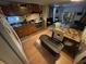 Cozy kitchen featuring wood cabinets, stainless steel appliances, and an adjacent dining area at 721 Crestview Dr, Casselberry, FL 32707