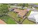 Aerial view of a home with a fenced backyard and a well-maintained lawn, offering privacy at 4120 Chelsea Ln, Lakeland, FL 33809