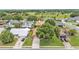 Aerial view of a neighborhood with mature trees and well-kept lawns, showcasing the home's location at 4120 Chelsea Ln, Lakeland, FL 33809