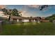 Expansive, green backyard with brick single Gathering home in the background at 4120 Chelsea Ln, Lakeland, FL 33809