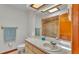 Bathroom featuring a large mirror and vanity with storage, and a shower reflected in the mirror at 4120 Chelsea Ln, Lakeland, FL 33809