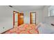 Cozy bedroom with warm tones, featuring two closets and windows providing natural light at 4120 Chelsea Ln, Lakeland, FL 33809