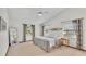 Bright bedroom with a ceiling fan, and two windows on either side of the bed at 4120 Chelsea Ln, Lakeland, FL 33809